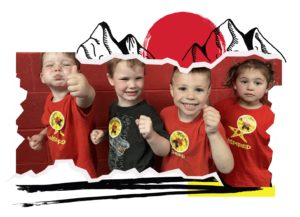 A line of students posing with their thumbs up